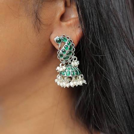 Big Silver Earrings With Peacock Green Saree For A Stunning Traditional Look